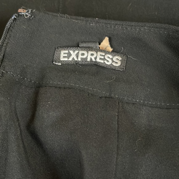EXPRESS BLACK KNEE LENGTH SKIRT maybe worn one time . Has accents on side to - Picture 3 of 4